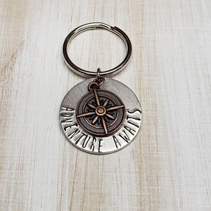 Adventure awaits compass keychain
